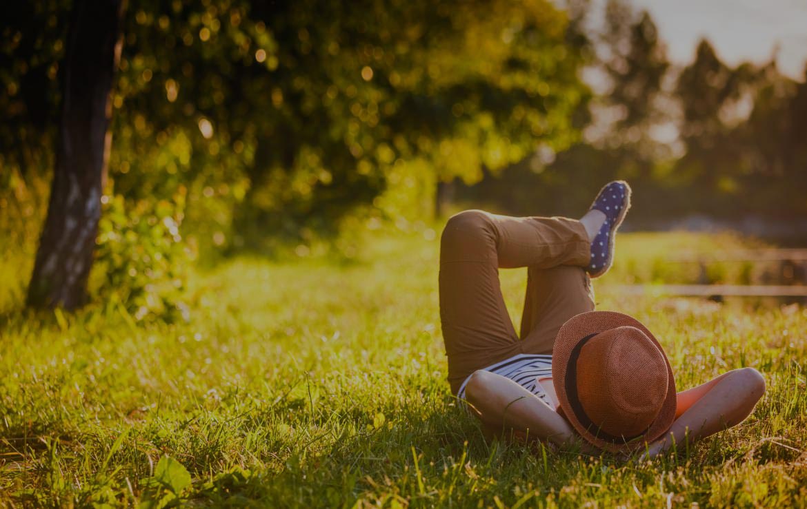 Person Laying on Grass Person Laying on Grass